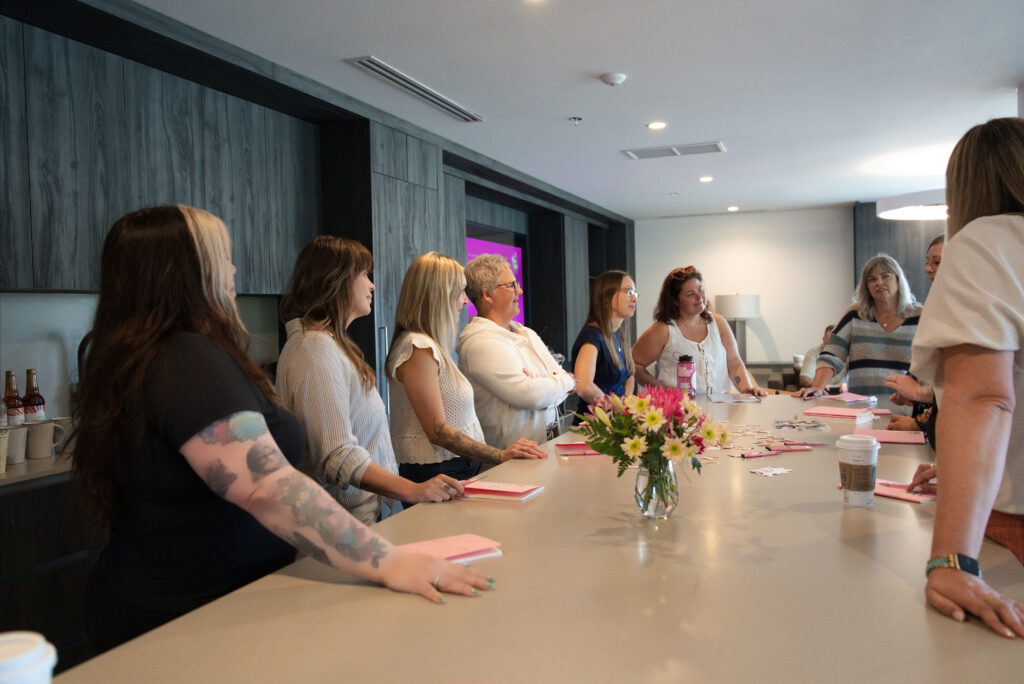 Writers working at the table during a Createcation retreat