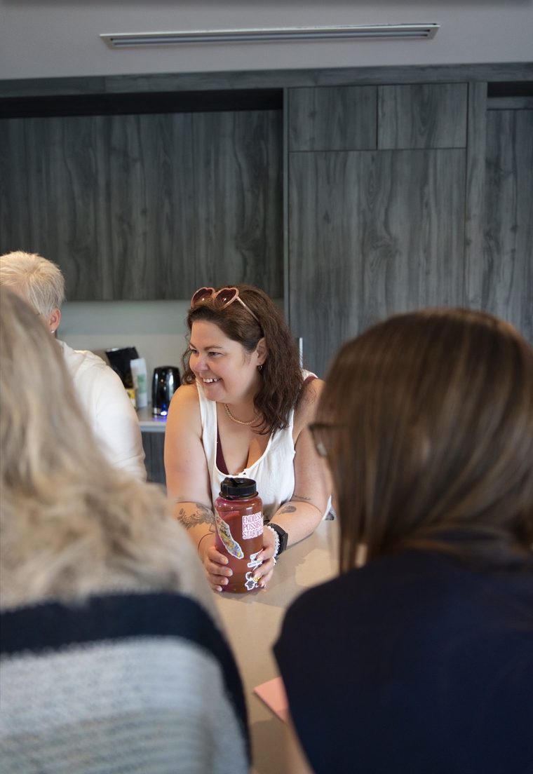 Crystal laughing with a writer at a Createcation