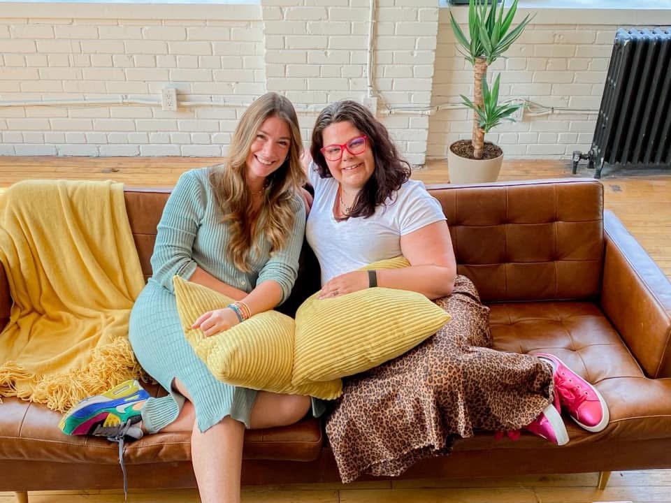 Crystal working with a client on the studio sofa