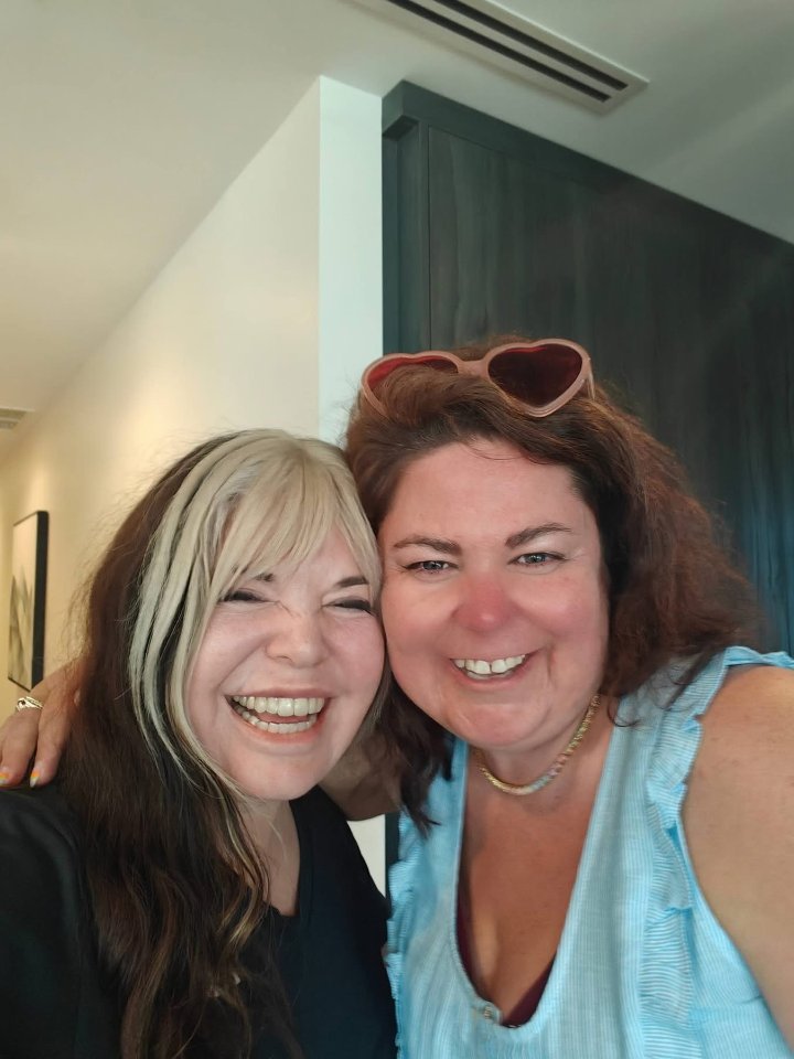 Crystal Adair-Benning laughing with a writer at a Createcation retreat