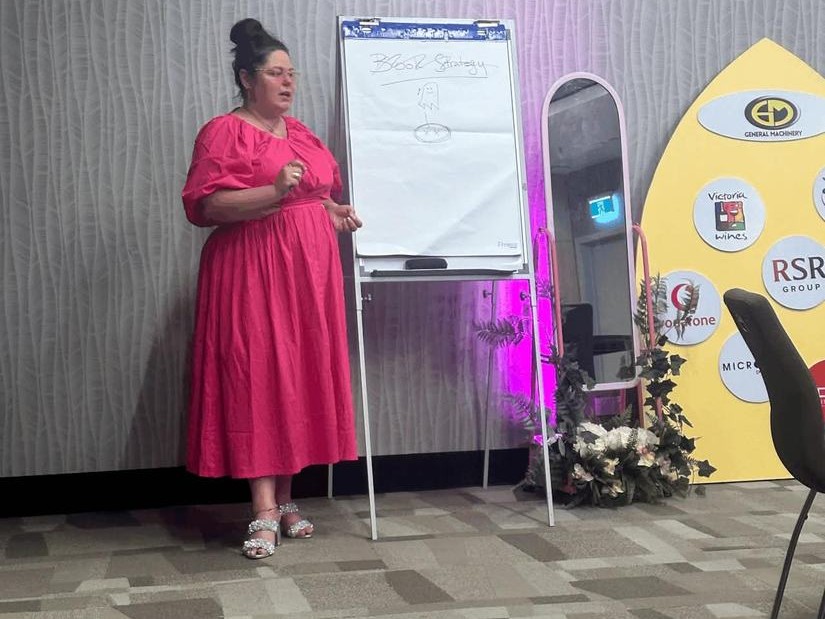 Crystal Adair-Benning teaching at a flipchart