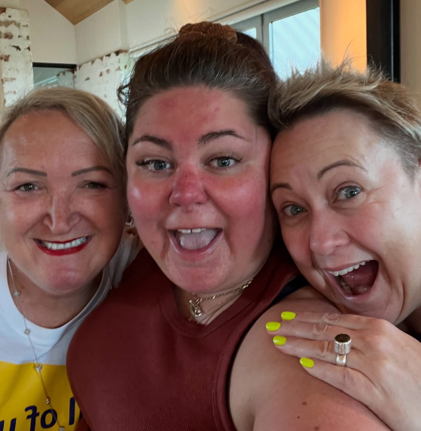 Three writers laughing together at a Createcation