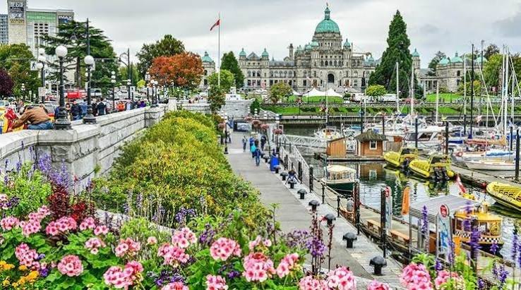 Victoria’s Inner Harbour with the Parliament Buildings and summer flowers