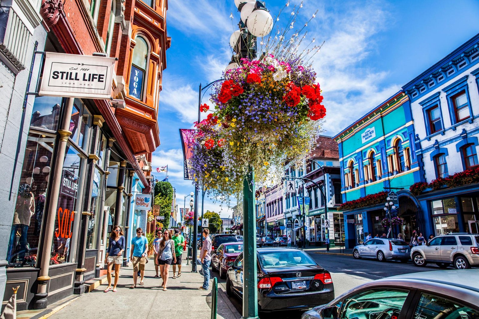 Hanging flower baskets and painted heritage shopfronts downtown
